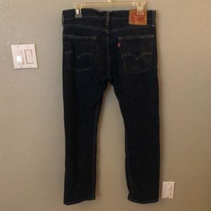 Men’s Levi 513 dark wash jeans.